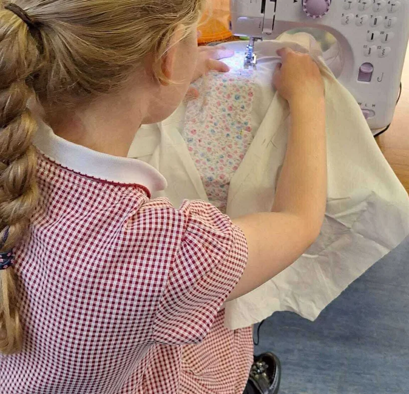 Child painting at easel
